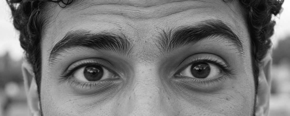 A young man's eyes, looking straight at the camera