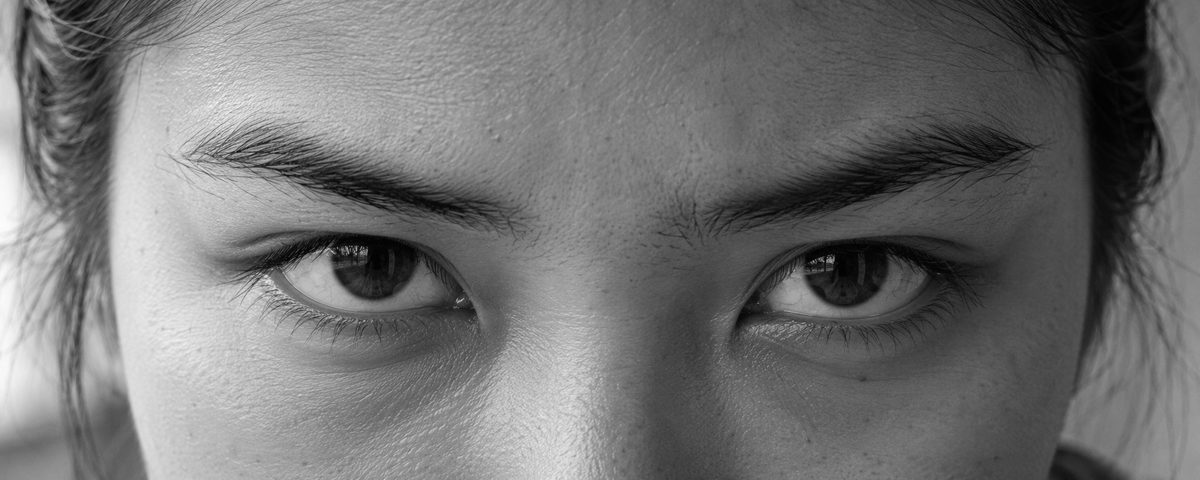 A young woman's eyes, looking straight at the camera